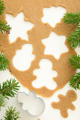 Gingerbread dough for Christmas cookies and cookie cutters.