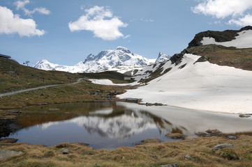 Fototapeta na wymiar Reflections in waters of Schwarzsee beneath Matterhorn