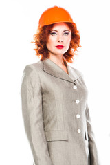 young beautiful woman in yellow construction helmet 