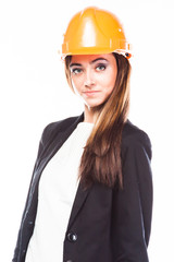 young beautiful woman in yellow construction helmet 