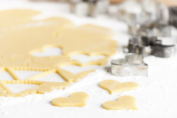 still life of dough with cookie cutters