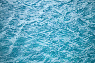 Fototapety  Blue sea water photo background texture with ripple