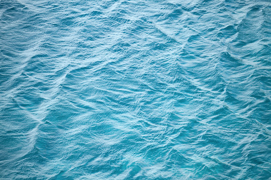 Blue sea water photo background texture with ripple