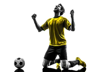 Fotobehang brazilian soccer football player young happiness joy kneeling ma © snaptitude