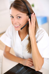 Portrait of smiling nurse with headset on