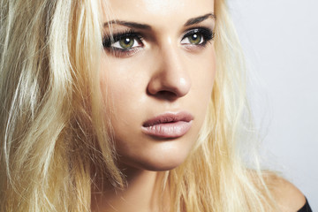 close-up beautiful blond girl with green eyes.woman.make-up