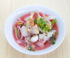 rice noodles in pink soup, thai cuisine