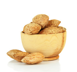 Almond in wooden bowl, isolated on white