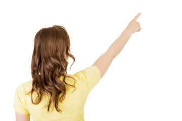 Happy , excited young woman pointing on copy space