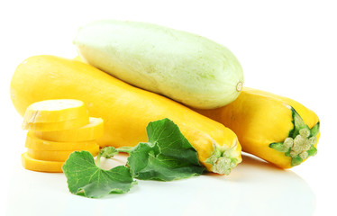 Sliced and whole raw zucchini, isolated on white
