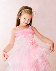 Portrait of smiling little girl in princess dress