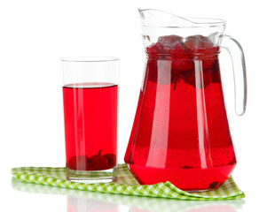 Pitcher and glass of compote on napkin isolated on white