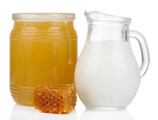 Honey and milk isolated on white