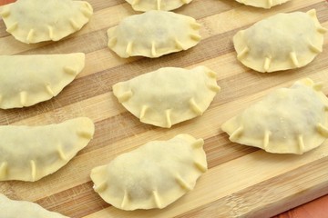 raw dumplings with sauerkraut and meat