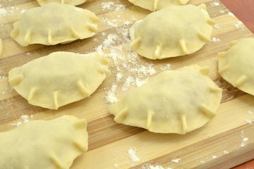 raw dumplings with sauerkraut and meat