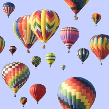 A group of colorful hot-air balloons floating across a blue sky