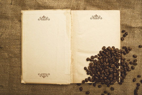 Coffee beans and open book