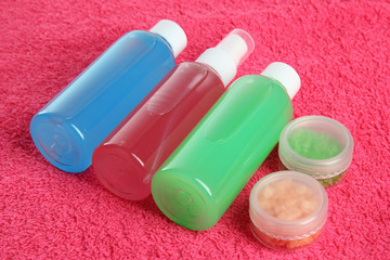 Hotel cosmetics kit on pink towel