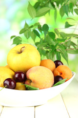 Bright summer fruits in plate
