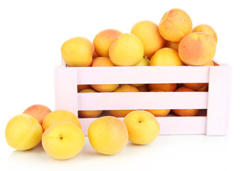 Fresh natural apricot in wooden box isolated on white