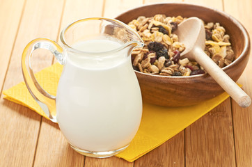 Plate with raw oatmeal on wooden table.