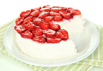 Cheesecake with fresh berries on white plate closeup