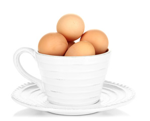 Eggs in cup isolated on white