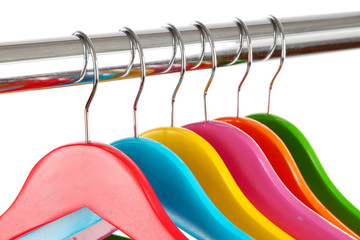 Colorful clothes hangers isolated on white