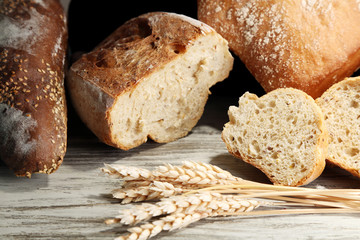Much bread on wooden board