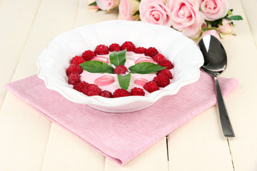 Sweet cream soup with fresh raspberry and sour cheese,