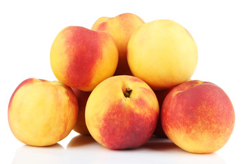 Ripe sweet peaches, isolated on white