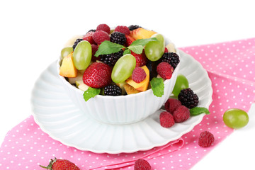 Fruit salad in bowl, isolated on white