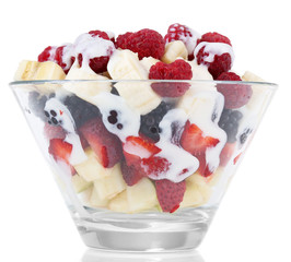 Fruit salad in glass bowl, isolated on white
