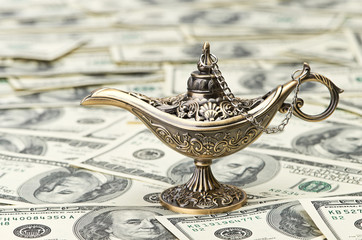 aladdin lamp on dollar background