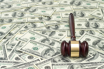 gavel on dollar background