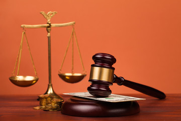 gavel, money , and scales of justice