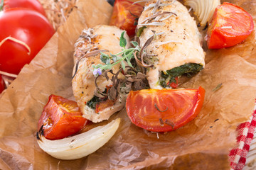 Chicken breast with spinach, baked tomatoes and herbs