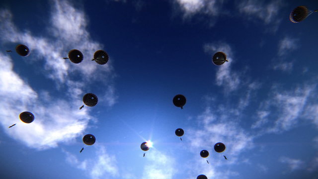 Several paratroopers descending in the sky