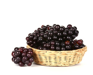 Grapes in basket on white background