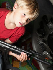 Fototapeta na wymiar Kid warrior, soldier, shooting