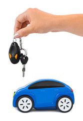 Hand with keys and car
