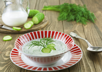 Summer soup with cucumbers, yogurt and fresh herbs