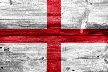 England Flag painted on old wood plank background
