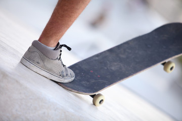 Foot and skateboard