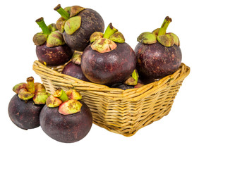 A basket of mangosteen over white background