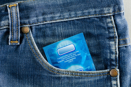 condom in the pocket of a blue jeans