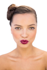 Obraz premium Cheerful woman with red lips giving a kiss