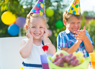 Happy children having fun at birthday party
