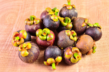 Fresh fruit in a basket on a wooden floor