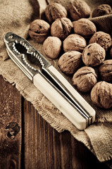 Walnuts on wooden boards. Vintage Retouch.